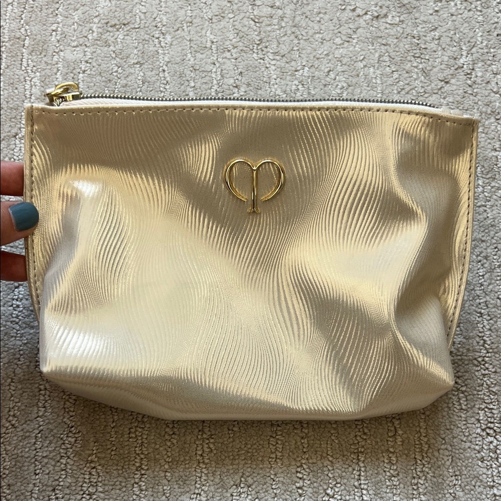 cle de peau Metallic Gold Cosmetic Pouch with Heart Emblem